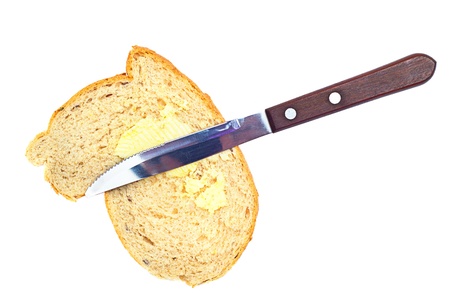 bread knife and butter on white backgroundの写真素材
