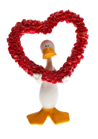 figurine of a duck with hearts on whiteの写真素材