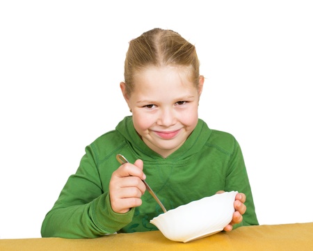 Girl eats isolated on whiteの写真素材