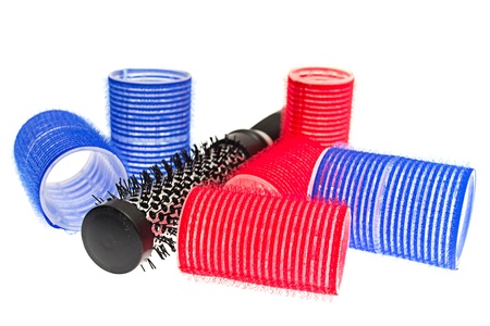 Curlers with hairbrush on whiteの写真素材