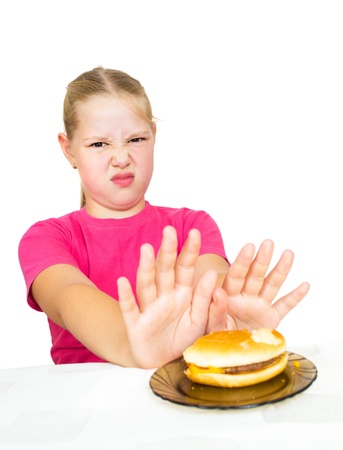 girl refuses hamburger isolated on whiteの写真素材