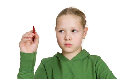 schoolgirl with red marker in hand on whiteの写真素材