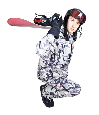 Portrait of handsome boy in sportswear with snowboard isolated on a white backgroundの写真素材