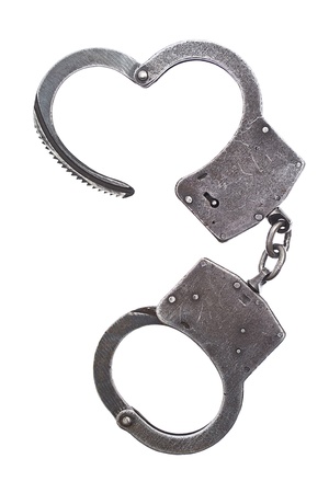 Metal handcuffs for hands on a white backgroundの写真素材