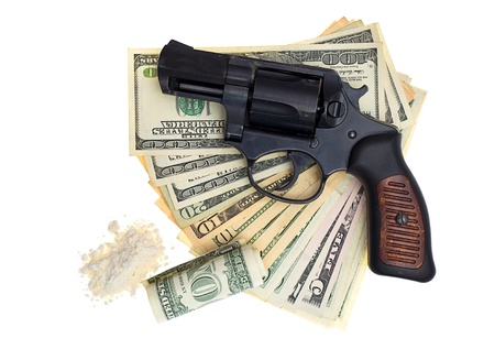 handcuffs, gun and money isolated on a white backgroundの写真素材