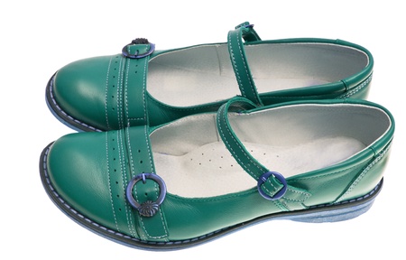 Green baby shoes on a white backgroundの写真素材