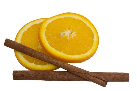 Orange and cinnamon sticks isolated on white background. の写真素材