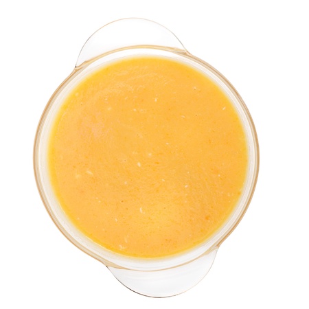 Puree soup in a glass bowl isolated on white backgroundの写真素材