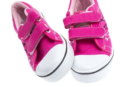 Pink sneakers isolated on white backgroundの写真素材