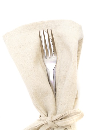 fork, knife, napkin on white 