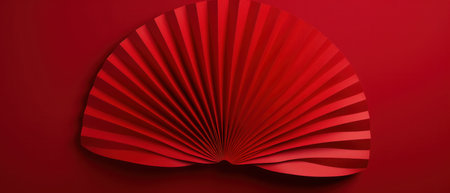 a pair of red paper fans on a red background, panoramic scale.の素材