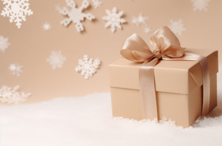 christmas box on beige background with snowflakes,の素材