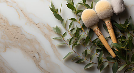 two bamboo toothbrushes and two leaves on gray tiled surface,の素材