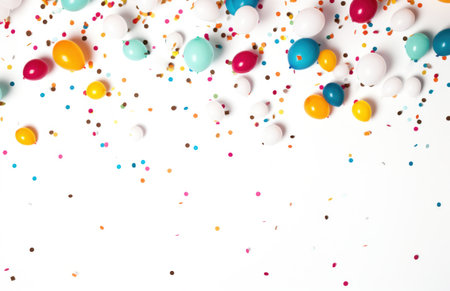 colorful multi color confetti balloons floating over white background.の素材