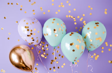pastel and aqua balloons with confetti on purple background.の素材
