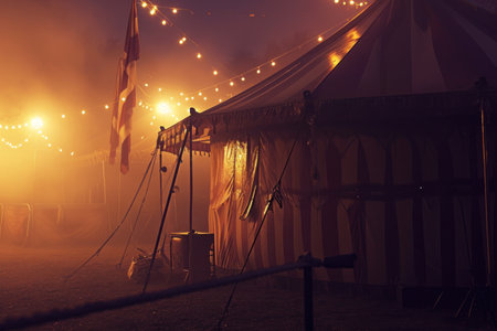 a circus tent with smoke as well as lights.の素材