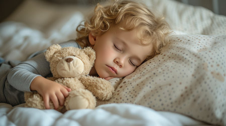 A little one fast asleep, clutching their favorite stuffed animal in a peaceful slumber.の素材