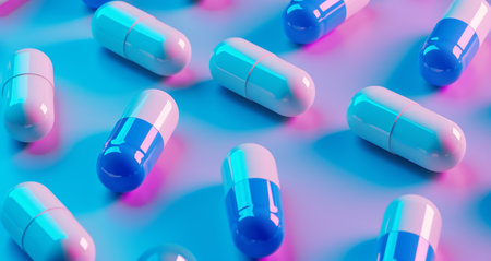 blue and white pills capsules on the surface.の素材