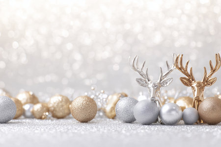Shiny Christmas ornaments in gold, silver, and glittery hues surround a golden reindeer on a soft surface with a sparkling background, creating a joyful festive atmosphere..の素材