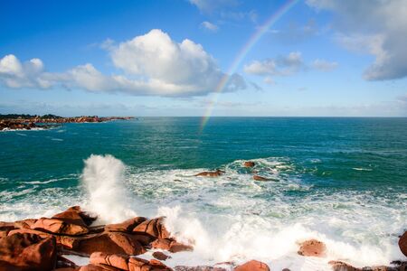Rainbow over the pink granite coast in Britany