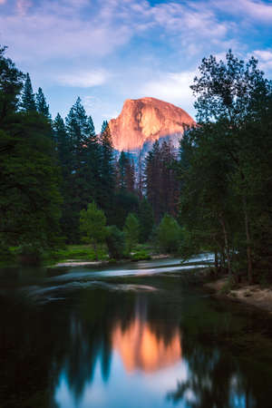 The half dome over the Mercedes river at sunsetの写真素材