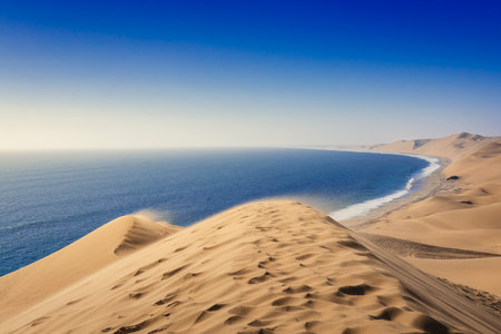Dunes over atlantic ocean near walvis bay