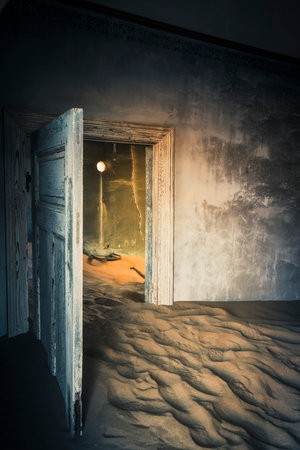 Doorway halfway burried in sand in abandoned house at Kolmanskopの写真素材