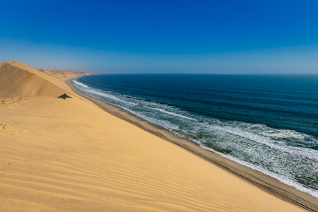 Stretch of desert dunes on the coast of Namibiaの写真素材
