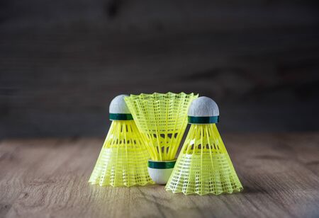 badminton racket with yellow balls
