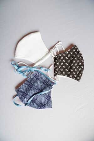 making home made breathing mask, corona virus protection. Protect cough, dust, pollution, COVID-19 and other contamination. Sewing virus face mask, home madeの写真素材