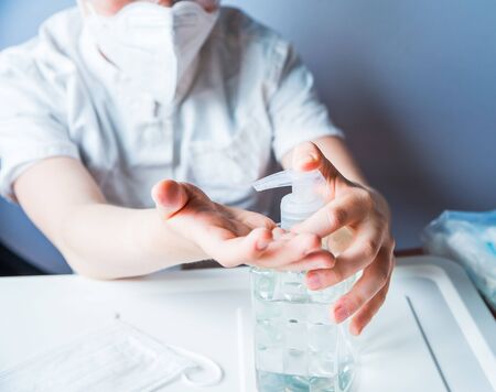 Cute boy wear medical uniform playing doctor. Coronavirus concept. Covid-19の写真素材