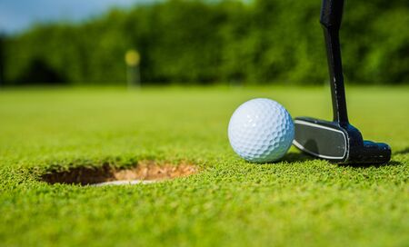 golf ball ang club on golf green grass natural  fairwayの写真素材