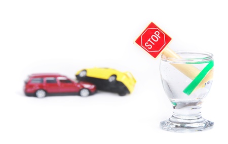 Car accident and wine glass with stop sign. Isolated oh white.の写真素材