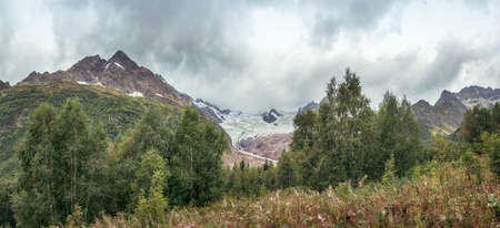 Alibek Glacier in the mountains of the Caucasus. Russia, Dombay, Karachay - Cherkessia, September 11, 2021の写真素材