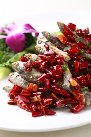 Fried fishes with dried chilliの写真素材