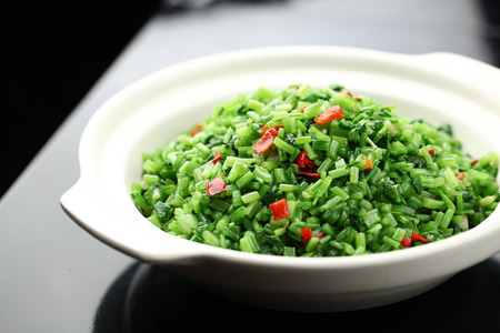 a bowl of fried vegetablesの写真素材