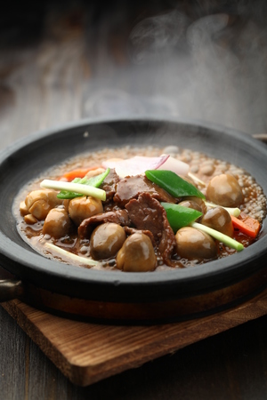 Chinese cuisine served on a sizzling plateの写真素材