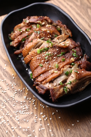 Roasted chicken served on a serving plateの写真素材