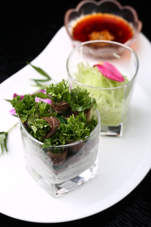 Meat roll salad served in a glassの写真素材