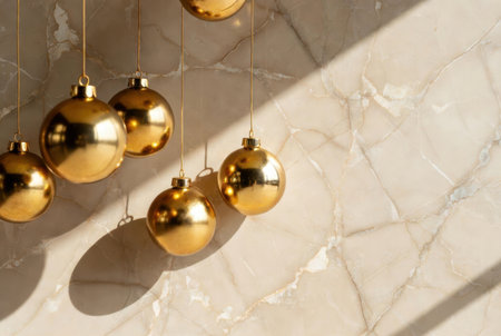 Golden ornaments with elegant depth of field over a marble background in a luxurious festive styleの素材