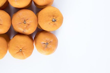 Isolated orange mandarin that is synonymous with the Chinese New Year celebration in the white backgroundの写真素材