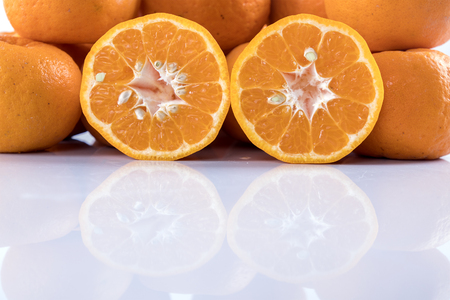 Isolated orange mandarin that is synonymous with the Chinese New Year celebration in the white backgroundの写真素材