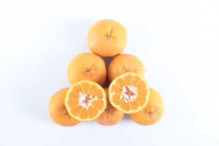 Isolated orange mandarin that is synonymous with the Chinese New Year celebration in the white backgroundの写真素材