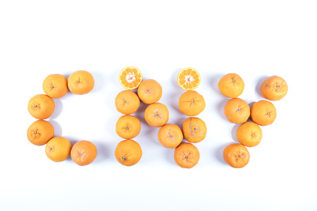 Isolated orange mandarin that is synonymous with the Chinese New Year celebration in the white backgroundの写真素材