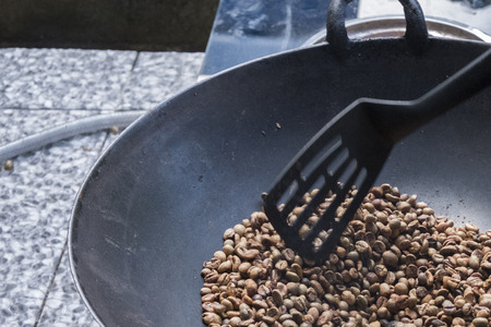 Bake coffee beans in a traditional way panの写真素材