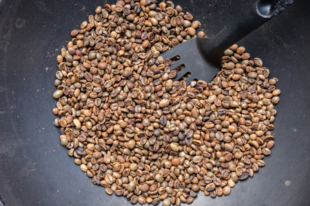 Bake coffee beans in a traditional way panの写真素材