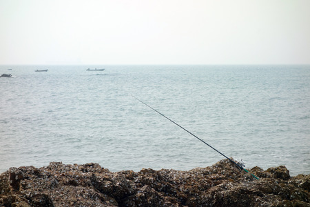 fishing pole at seasideの写真素材