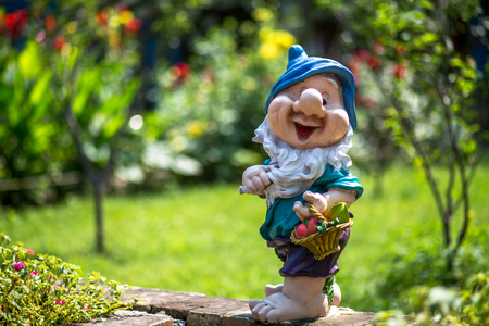 Dwarf statue in a gardenの写真素材
