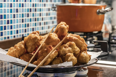 fried fermented doughs in oilの写真素材