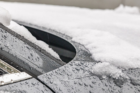close up snow on the carの写真素材